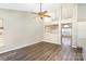 This is an open-concept living area showcases vaulted ceilings, wood floors, and natural light at 12810 English Walnut Ln, Charlotte, NC 28215