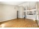Spacious living area features vaulted ceilings and seamless flow into the kitchen, promoting connectivity at 12810 English Walnut Ln, Charlotte, NC 28215