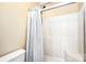 Bathroom shower with a grey shower curtain at 12810 English Walnut Ln, Charlotte, NC 28215