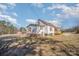 Side view of home featuring a covered back porch and spacious yard at 15 Gumtree St, Wadesboro, NC 28170