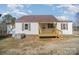 Charming home featuring a covered front porch and metal roof at 15 Gumtree St, Wadesboro, NC 28170