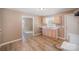 Bright kitchen with new flooring and light wood cabinetry at 15 Gumtree St, Wadesboro, NC 28170