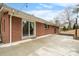 A spacious concrete back patio is accessible through glass sliding doors on a brick home at 1525 16Th Avenue Nw Cir, Hickory, NC 28601