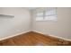 Modest bedroom with hardwood floors and a single window at 1525 16Th Avenue Nw Cir, Hickory, NC 28601