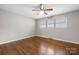 Bedroom featuring hardwood floors, ceiling fan, and natural light from the multiple windows at 1525 16Th Avenue Nw Cir, Hickory, NC 28601