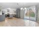 Open kitchen and dining area with stainless steel appliances and sliding glass doors to the backyard at 1525 16Th Avenue Nw Cir, Hickory, NC 28601
