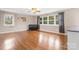 Spacious living room with hardwood floors, large windows, and a ceiling fan at 1525 16Th Avenue Nw Cir, Hickory, NC 28601