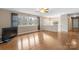 Bright living room featuring hardwood floors, large windows, and a built-in storage area at 1525 16Th Avenue Nw Cir, Hickory, NC 28601
