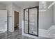 Bathroom with tiled shower and glass doors, and neutral paint at 15606 Walnut Hill Dr, Charlotte, NC 28278