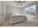 Bright bedroom with carpet and ceiling fan and large window at 15606 Walnut Hill Dr, Charlotte, NC 28278