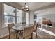 Bright dining area with large windows, modern lighting, and easy access to the living space at 15606 Walnut Hill Dr, Charlotte, NC 28278