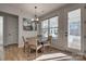 Cozy dining area with a round table, stylish chairs, a modern light fixture, and natural light at 15606 Walnut Hill Dr, Charlotte, NC 28278