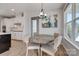 Charming dining area adjacent to the kitchen, featuring a round table and a stylish light fixture at 15606 Walnut Hill Dr, Charlotte, NC 28278