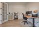 Well-lit home office featuring a desk setup, French doors, and neutral decor for a productive workspace at 15606 Walnut Hill Dr, Charlotte, NC 28278