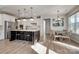 Modern kitchen featuring a center island with seating, stainless steel appliances, and white cabinetry at 15606 Walnut Hill Dr, Charlotte, NC 28278
