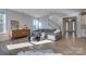 Bright living room with a large sectional sofa, hardwood floors, and an open layout for entertaining guests at 15606 Walnut Hill Dr, Charlotte, NC 28278