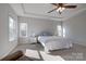 Bright main bedroom with two windows and a ceiling fan at 15606 Walnut Hill Dr, Charlotte, NC 28278
