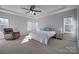 Spacious main bedroom featuring a tray ceiling and two windows at 15606 Walnut Hill Dr, Charlotte, NC 28278