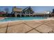 Resort-style pool and sundeck area with a cabana, offering a luxurious outdoor experience at 15606 Walnut Hill Dr, Charlotte, NC 28278