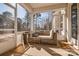 Relaxing screened porch with comfortable seating and views of the beautiful natural surroundings at 15606 Walnut Hill Dr, Charlotte, NC 28278