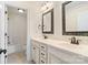 Bathroom featuring double sinks, granite countertops, custom cabinets, and a tub and shower combination at 1730 Townsend Ln, Rock Hill, SC 29730