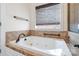 This bathroom is equipped with a large soaking tub and tiled walls and flooring at 1730 Townsend Ln, Rock Hill, SC 29730