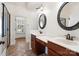 The bathroom features double sinks, dark wood cabinets, and a walk-in tiled shower with a glass door at 1730 Townsend Ln, Rock Hill, SC 29730
