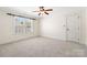Empty bedroom featuring neutral carpet, window with blinds and door at 1730 Townsend Ln, Rock Hill, SC 29730