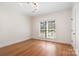 Empty bedroom with hardwood floors, large windows, and a neutral color scheme at 1730 Townsend Ln, Rock Hill, SC 29730