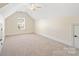 Bedroom featuring vaulted ceilings, neutral carpet, window and door at 1730 Townsend Ln, Rock Hill, SC 29730