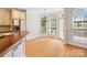 Sunlit breakfast nook featuring hardwood floors, a chandelier, and views of the backyard at 1730 Townsend Ln, Rock Hill, SC 29730