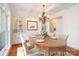 Elegant dining room with coffered ceiling, chandelier, built-in cabinets, and wood table at 1730 Townsend Ln, Rock Hill, SC 29730