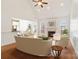 Bright living room with fireplace, hardwood floors, wainscoting and views to backyard at 1730 Townsend Ln, Rock Hill, SC 29730
