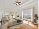 Sun-filled main bedroom with tray ceiling, windows, hardwood floors, and neutral decor at 1730 Townsend Ln, Rock Hill, SC 29730
