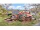 Aerial view of a charming brick home with lush landscaping and a barn in a picturesque countryside setting at 1783 Reepsville Rd, Lincolnton, NC 28092