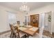 Classic dining room with a chandelier, hardwood floors, and a built-in china cabinet for elegant entertaining at 1783 Reepsville Rd, Lincolnton, NC 28092