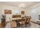 Bright dining room featuring a traditional rug, picture frames, and a wooden table perfect for meals and gatherings at 1783 Reepsville Rd, Lincolnton, NC 28092