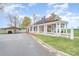 A well-manicured lawn surrounds this lovely red brick home, carport, and white picket fence at 1783 Reepsville Rd, Lincolnton, NC 28092