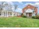 Charming brick home boasts a lush green lawn and a porte cochere for convenient covered parking at 1783 Reepsville Rd, Lincolnton, NC 28092