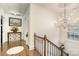 Elegant hallway features hardwood floors, chandelier, and stylish decor for a sophisticated and welcoming entrance at 1783 Reepsville Rd, Lincolnton, NC 28092