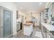 Open kitchen with a butcher block island, gray cabinets, stainless appliances, and access to pantry and eat-in kitchen at 1783 Reepsville Rd, Lincolnton, NC 28092