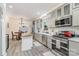Bright, updated kitchen features gray cabinets, stainless steel appliances, and a butcher block island adjacent to the eat-in area at 1783 Reepsville Rd, Lincolnton, NC 28092