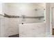 A modern shower featuring marble tiles, sleek glass enclosure, and stylish fixtures at 1783 Reepsville Rd, Lincolnton, NC 28092
