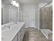 Bathroom featuring a shower, sink, and large mirror at 2018 Hyacinth Ct, Denver, NC 28037