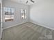 Bedroom with carpet, natural light from two windows, ceiling fan, and closet at 2018 Hyacinth Ct, Denver, NC 28037