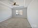 Spacious bedroom with natural light, a ceiling fan, and neutral carpet at 2018 Hyacinth Ct, Denver, NC 28037