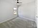 Bedroom with carpet, natural light from window, ceiling fan, and closet at 2018 Hyacinth Ct, Denver, NC 28037