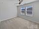 Cozy bedroom with carpet flooring, windows, and a ceiling fan at 2018 Hyacinth Ct, Denver, NC 28037