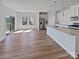 Bright, open-concept kitchen featuring a large island with quartz countertops and stainless steel appliances at 2018 Hyacinth Ct, Denver, NC 28037