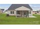 Spacious backyard featuring a covered patio perfect for outdoor living and entertaining at 2018 Mantle Ridge Dr, Indian Trail, NC 28079